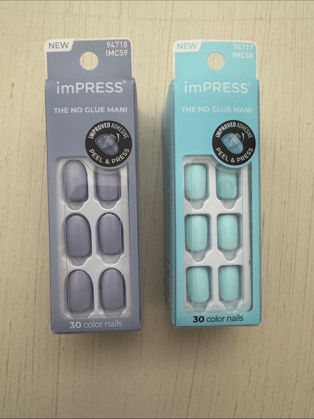 NIB IMPRESS set of 2-one is light blue and the other is periwinkle.